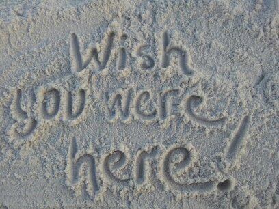Wish You Were Here written in the sand